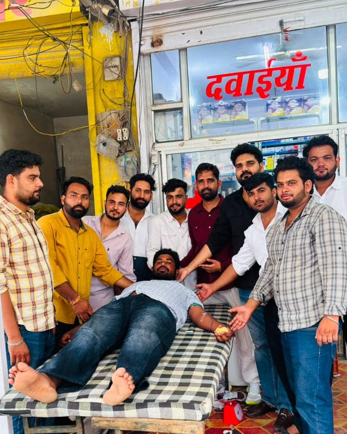 Blood donation in progress on a camp bed at Badpipli main bus stand, Sikar Road, Jaipur